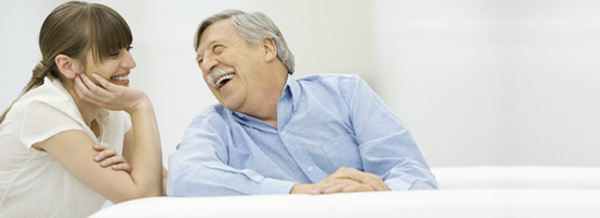 A patient advocate smiles at her elderly client