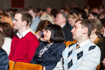 people sit in the audience at a health care conference